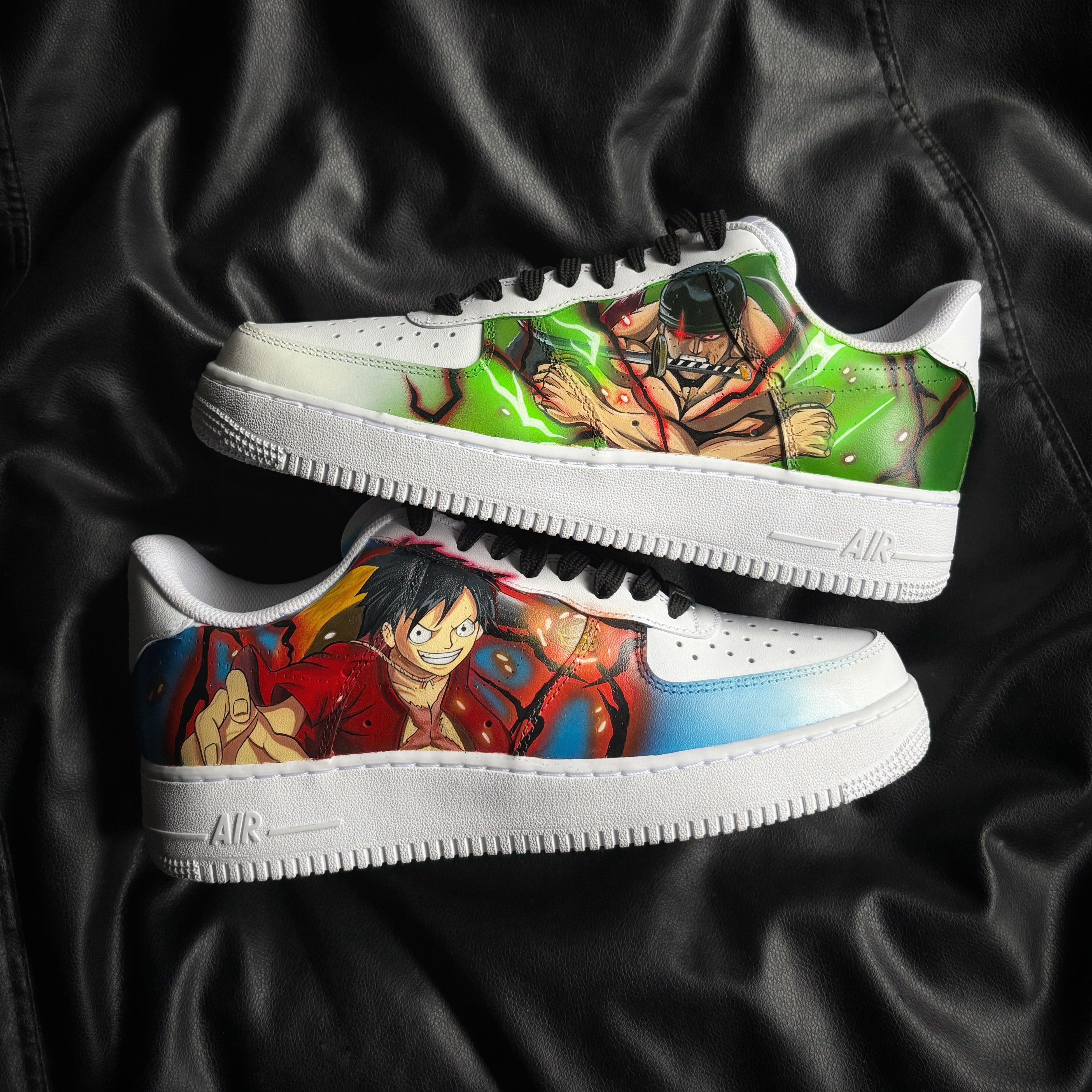 Luffy and Zoro One Piece x Nike Air Force 1 custom sneakers featuring hand-painted anime artwork in red, blue and green.