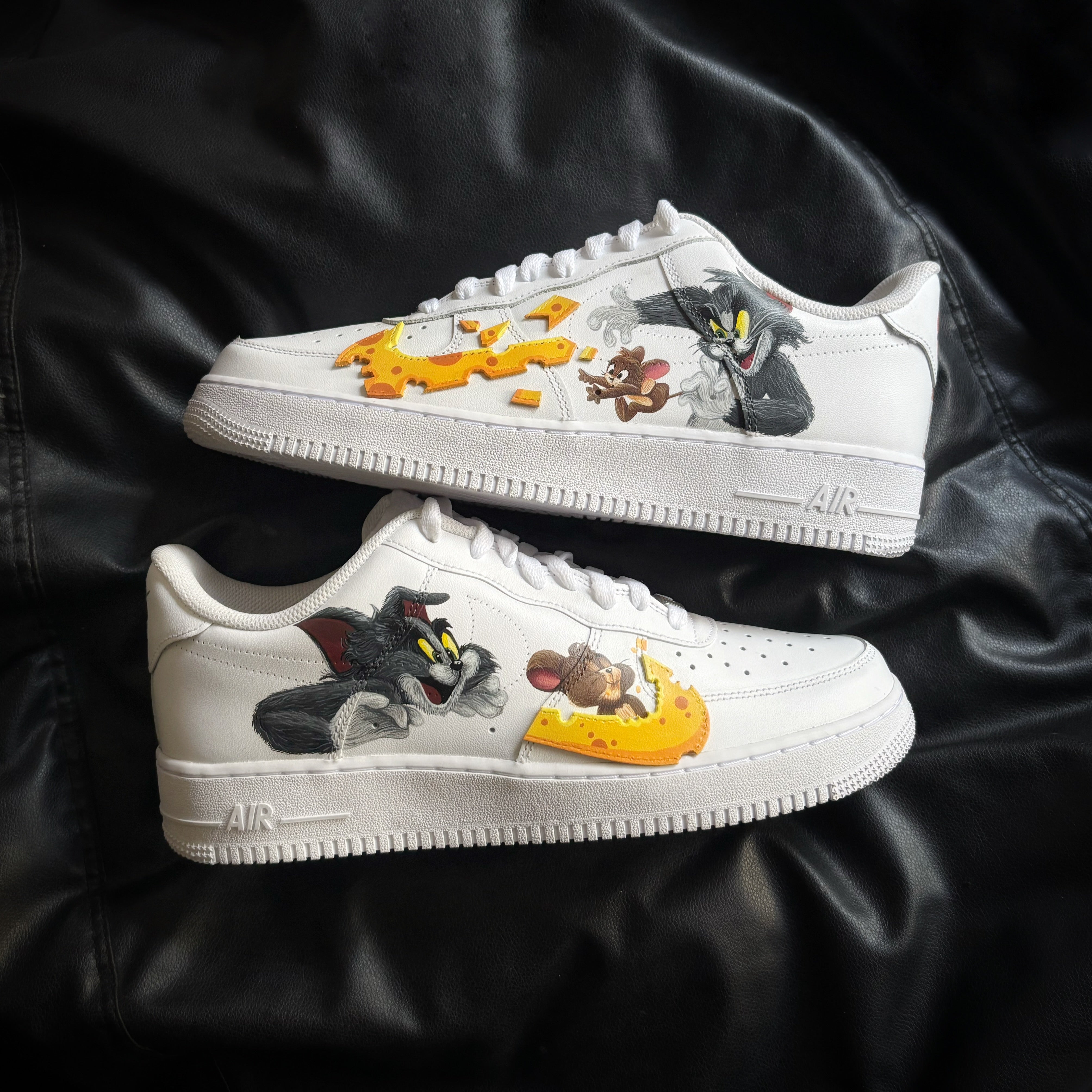 Tom & Jerry x Nike Air Force 1 custom hand-painted sneakers with cheese swoosh artwork on authentic Nike AF1 by Knickgasm.