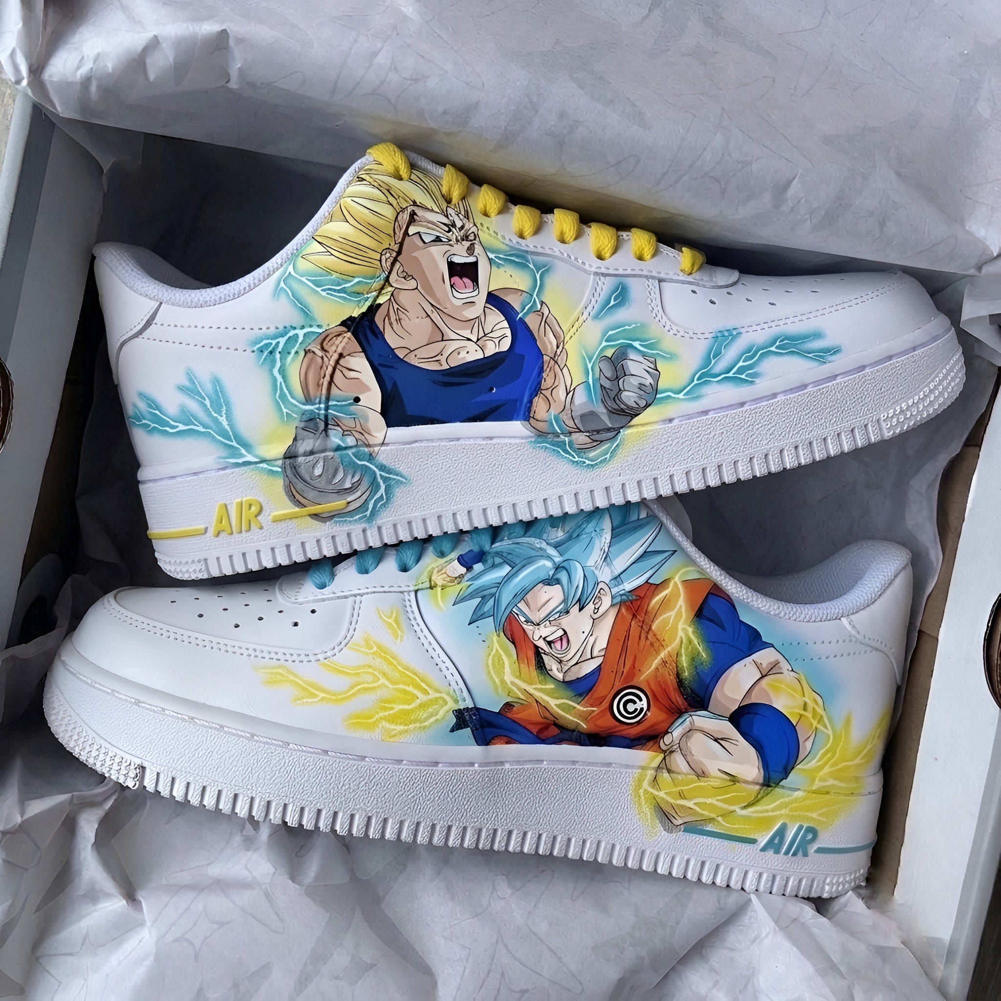 Hand-painted Dragon Ball Z x Nike Air Force 1 custom sneakers inspired by Super Saiyan Goku and Vegeta, crafted on authentic Nike Air Force 1s with water and scratch-resistant artwork, designed in India and shipped worldwide for free.